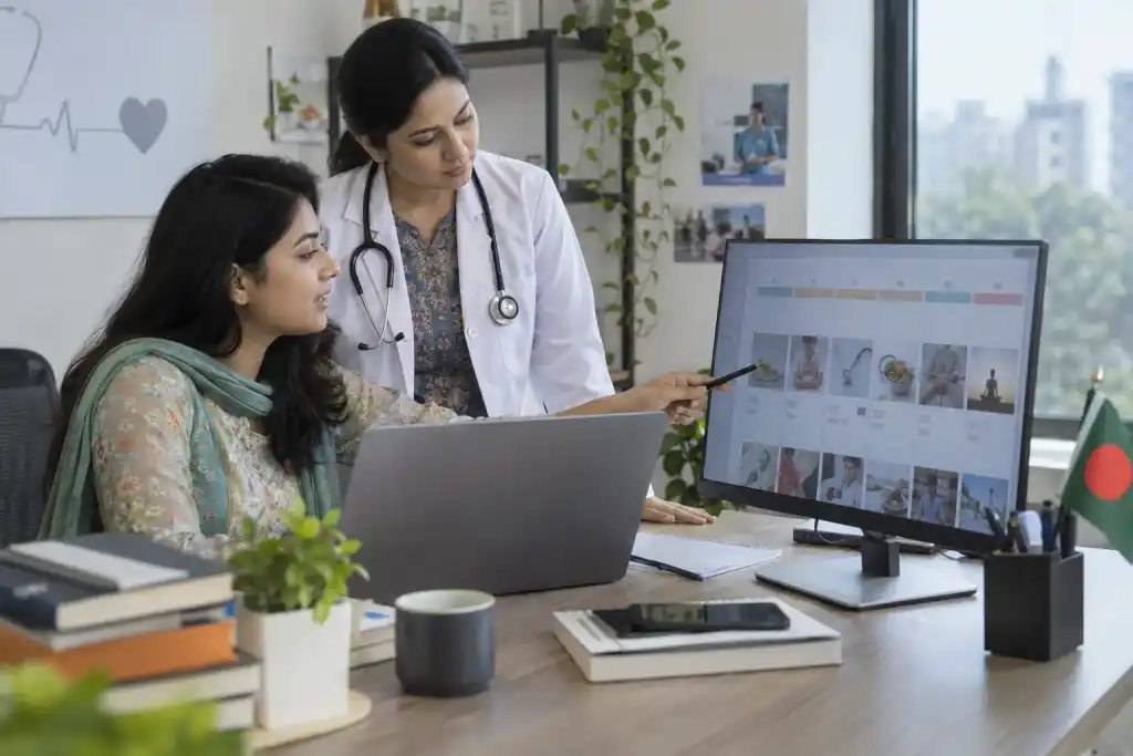 At a digital agency content desk, a civilian strategist arranges an educational post calendar with neutral thumbnail cards while a doctor checks clinical accuracy.