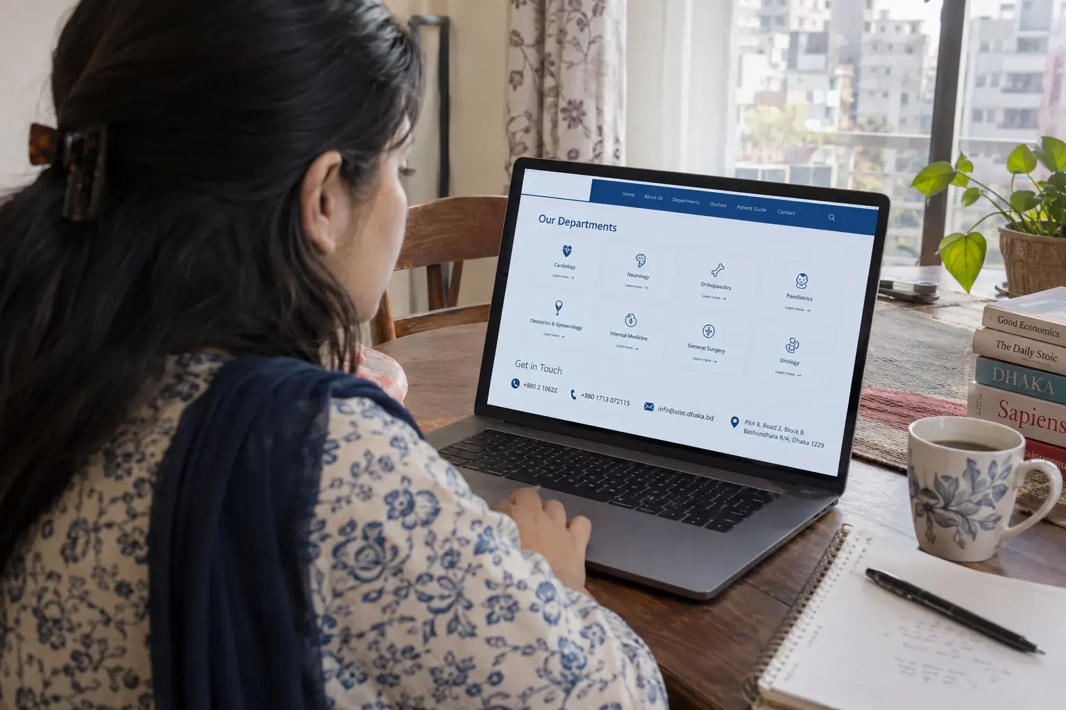 Person at home researching hospital information online in Bangladesh